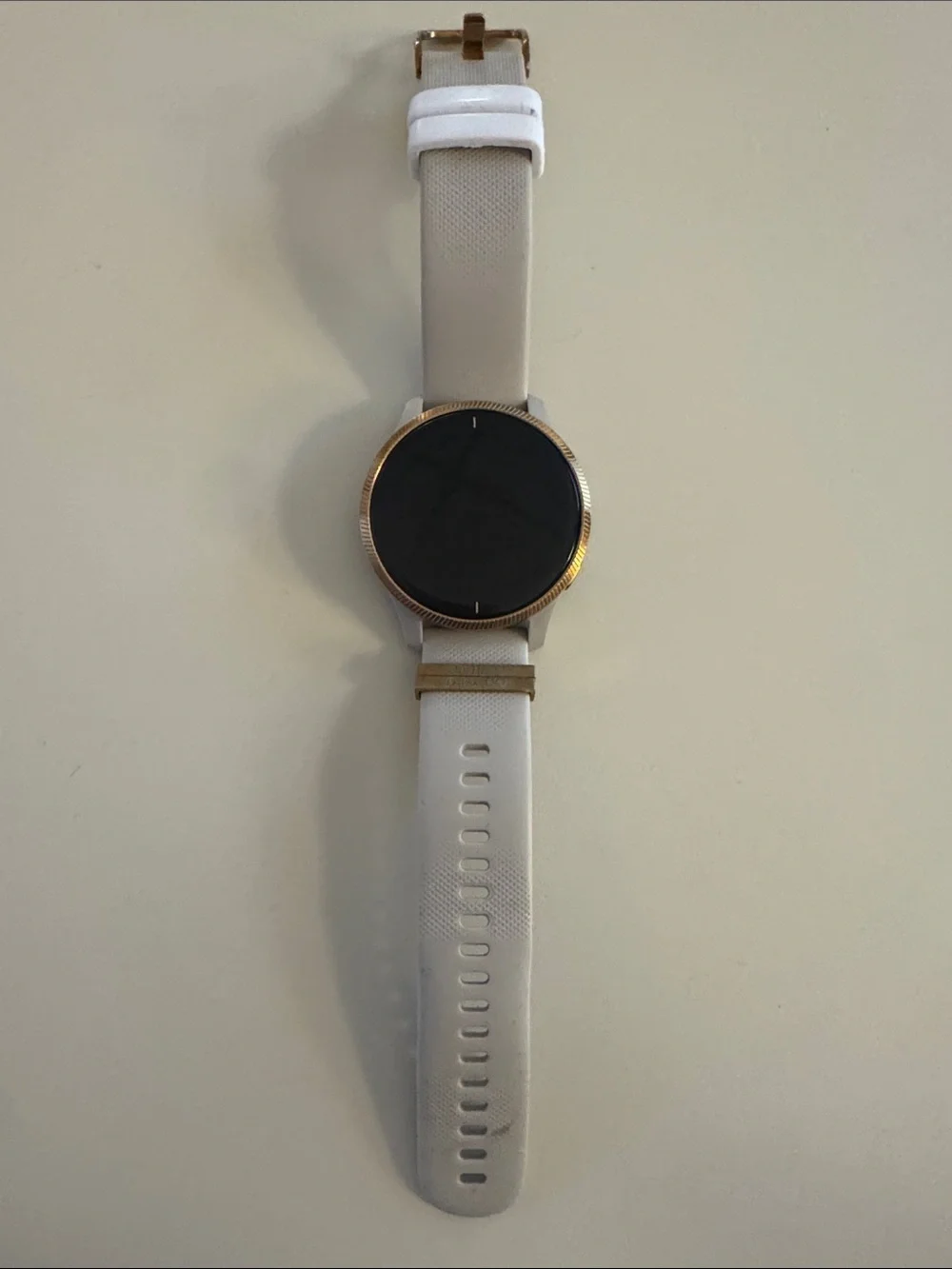 Garmin Venu Smartwatch with tan/cream Strap and rose gold Bezel